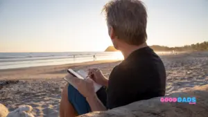 Good Dad Journaling On The Beach